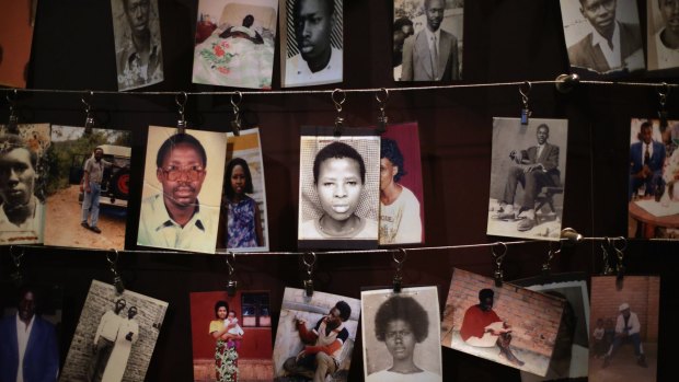 In 2014, family photos of victims of the 1994 Rwanda genocide hang inside the Kigali Genocide Memorial Centre in Kigali, Rwanda. 