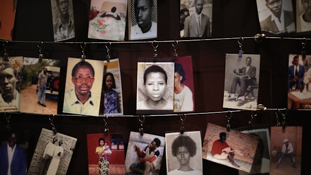 In 2014, family photos of victims of the 1994 Rwanda genocide hang inside the Kigali Genocide Memorial Centre in Kigali, Rwanda. 