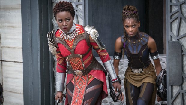 Lupita Nyong'o, left, and Letitia Wright in a scene from Marvel Studios' <i>Black Panther</i>.