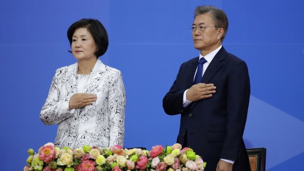 South Korea's new President Moon Jae-In and his wife Kim Jung-Suk salute during the presidential inauguration ceremony at National Assembly in Seoul on May 10.