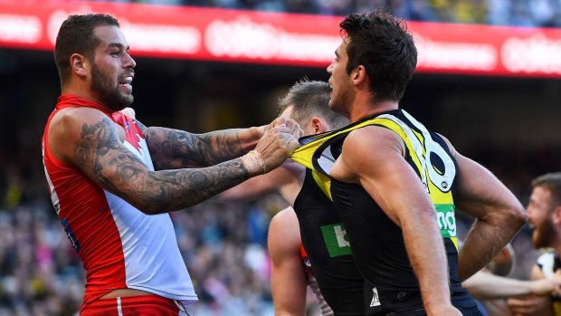 Lance Franklin tussles with Alex Rance. He was reported for rough conduct on Connor Menadue.