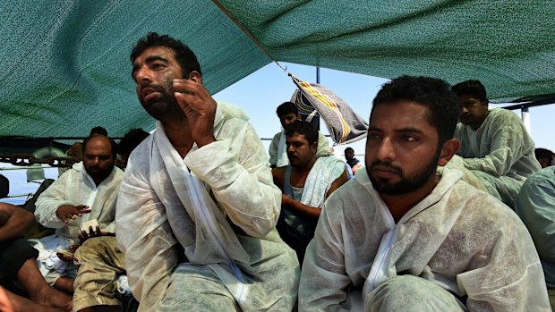 Ahmed, 28, (second from left) from Pakistan, on the MY Phoenix heading to Italy. 