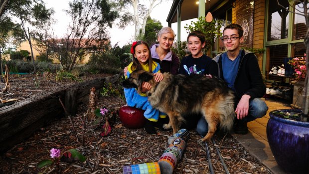 Kim Grant with her three children, Molly Ashleigh, 11, Liam Ashleigh, 13, and Rory Ashleigh, 15, at their new home.