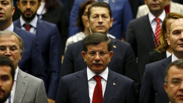 Turkey's Prime Minister Ahmet Davutoglu attends a meeting at his ruling AK Party headquarters in Ankara, Turkey on Friday.