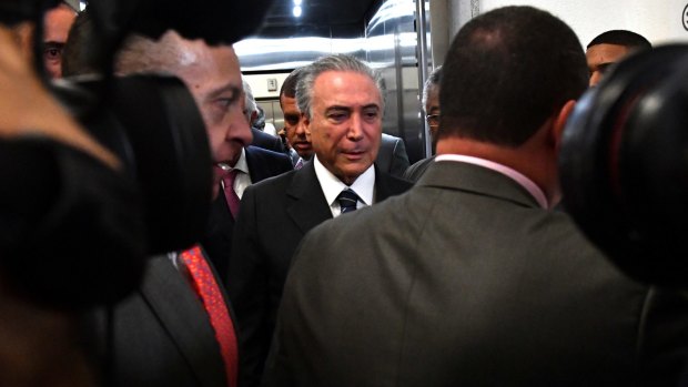 Booed at the opening and closing ceremonies and now under investigation for corruption: Brazilian President Michel Temer.