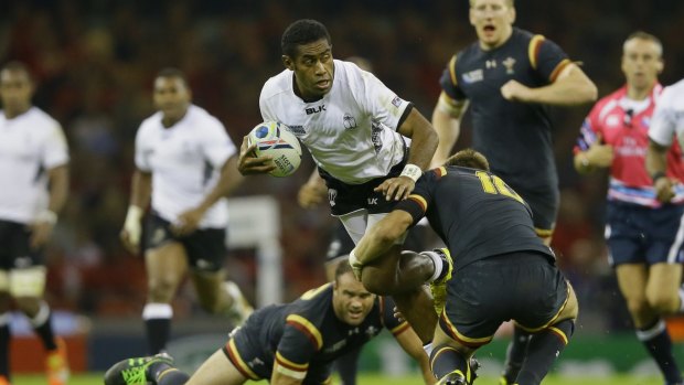 Fiji's Asaeli Tikoirotuma looks to offload against Wales.