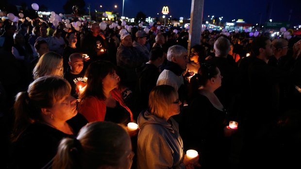 Thousands gather for a candlelight vigil at the shopping centre where the mother-of-two was killed. 