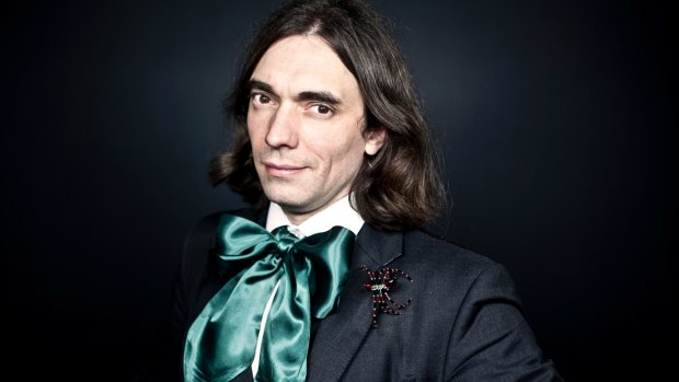 Prize-winning mathematician Cedric Villani with one of his many trademark spider brooches. 