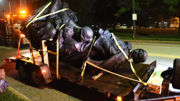 A monument dedicated to the Confederate Women of Maryland lies on a trailer to be taken away from Baltimore.