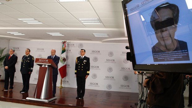 Renato Sales gives a news conference in Mexico City on Friday announcing the capture of a man believed to handle the finances for the Jalisco New Generation drugs cartel. The men inside the ranch in May 2015 are suspected to have belonged to the same cartel.