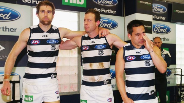 Mad Monday: Tom Lonergan, Steve Johnson and Mathew Stokes after the Cats' win over
Adelaide on Saturday.