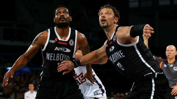 Ramone Moore and David Anderson of Melbourne United box out during the round three NBL match between Melbourne United and Brisbane Bullets at Hisense Arena.