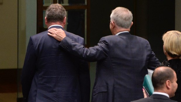 Deputy Prime Minister Barnaby Joyce and Prime Minister Malcolm Turnbull leave the chamber after the citizenship motion.