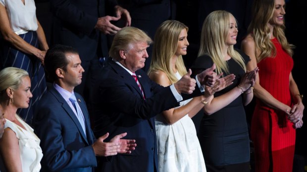 Donald Trump cheers the speech of his son Eric, with his family at the Republican Convention in July 20.