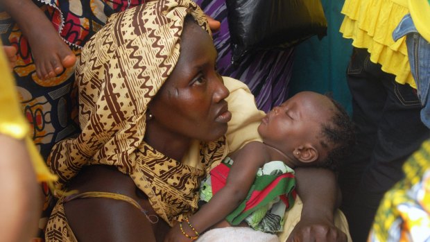 A Sierra Leonean mother attends a medical program launch in the country's capital, Freetown. 