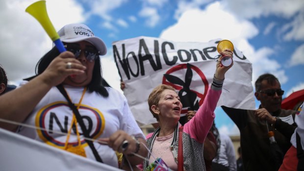 Opponents of the peace agreement also gathered outside Congress in Bogota.