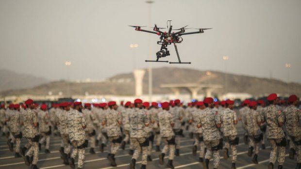 A drone is used to record a military parade by Saudi security forces in preparation for the annual Hajj pilgrimage in Mecca, Saudi Arabia. Saudi Arabia is one of the US's biggest weapons buyers.