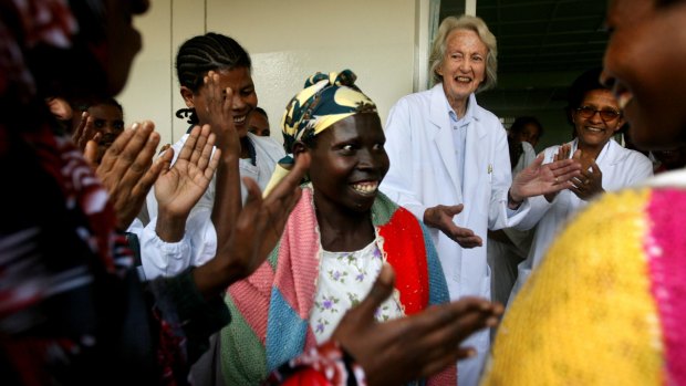 Dr Catherine Hamlin celebrates with staff and cured patients who are heading home after treatment.
