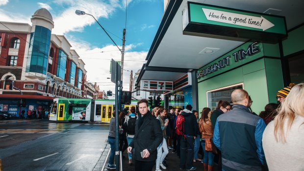 Crowds queue at the new Doughnut Time store in Chapel Street, Windsor.
