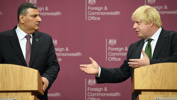 Boris Johnson, seen here with Syrian opposition leader Riyad Hijab earlier this week, has backed the opposition's proposals for a transition in the war-torn nation.