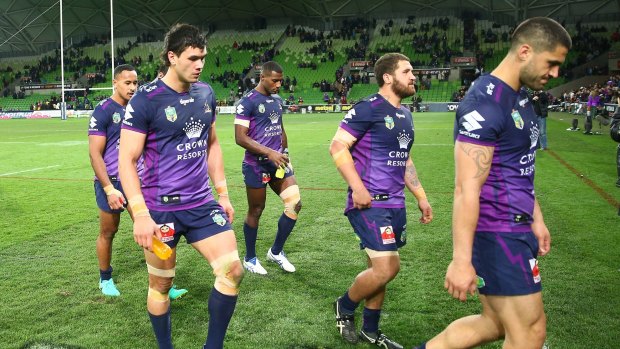 Beaten favourites: The Storm leave the field after losing the round 25 NRL match between Melbourne and the Brisbane Broncos at AAMI Park.