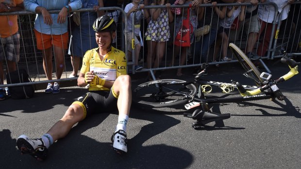Germany's Tony Martin, wearing the overall leader's yellow jersey, lies on the road with a broken collarbone after crashing in the last kilometers of the sixth stage of the Tour de France.