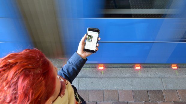 Mind the tracks ... the town of Augsburg in Germany has outfitted two light rail stations with experimental traffic signals for oblivious phone users.