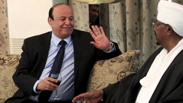 Yemeni President Abed-Rabbu Mansour Hadi drinks with Sudanese President Omar Hassan al-Bashir in Khartoum last week. Sudan is a member of the Saudi-led coalition seeking to restore Mr Hadi.
