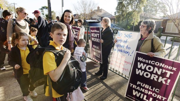 Residents and parents protested against the M5 East at Haberfield Public School on Friday.