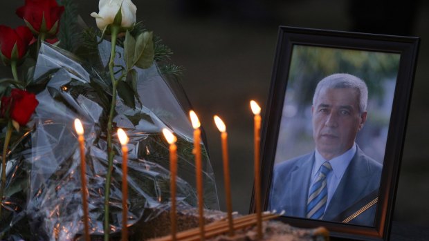 Flowers, candles and a picture of Kosovo Serb politician Oliver Ivanovic, at the spot where he was shot dead on Tuesday.