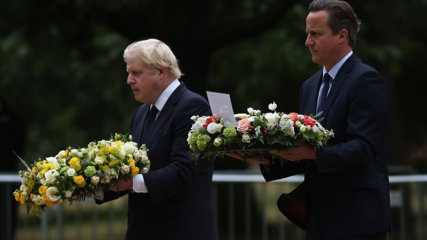 British Prime Minister David Cameron and London Mayor Boris Johnson lay wreaths during a ceremony at the memorial to the victims of the July 7, 2005 London bombings in Hyde Park.