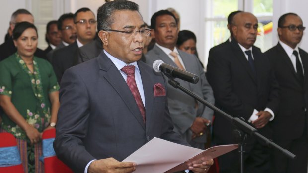 East Timorese Prime Minister Rui Araujo reads out the oath of office.