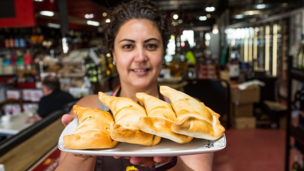 Maria de la Plaza and her husband Marco make authentic empanadas at Latin Foods and Wine.