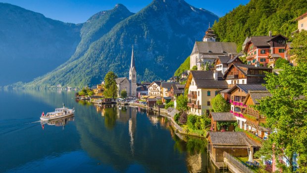Scenic picture-postcard view of famous Hallstatt mountain village in the Austrian Alps.