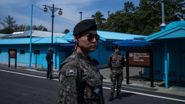 Soldiers stand guard outside the meeting rooms that straddle the border between the North and South Korea in the Demilitarided Zone in South Korea.
