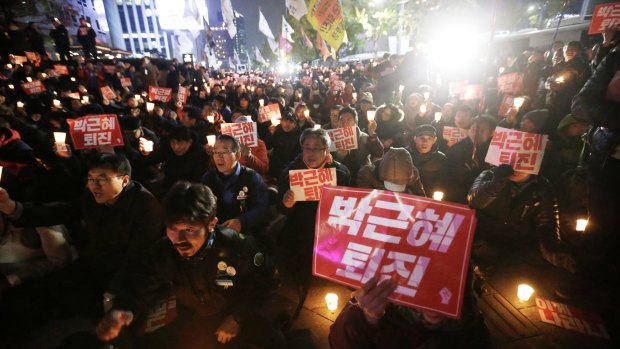 Protesters call on South Korean President Park Geun-hye to resign.