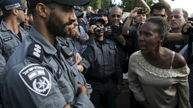A protester, an Israeli Jew of Ethiopian origin, shouts at a policeman during a protest in Tel Aviv on Sunday. 