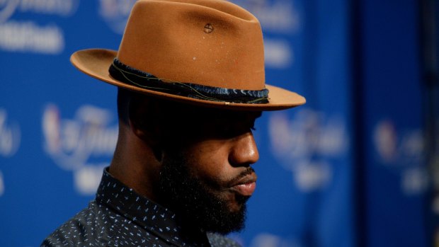 Suave: LeBron James dresses up to talk to the media.