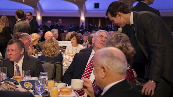 Jared Kushner, standing on the right, speaks to US Secretary of State Rex Tillerson at the National Prayer Breakfast in Washington on February 2. Jordan's King Abdullah II sits to Tillerson's right.