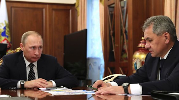 Russian President Vladimir Putin discusses the cease-fire with Defence Minister Sergei Shoigu in Moscow on Thursday.