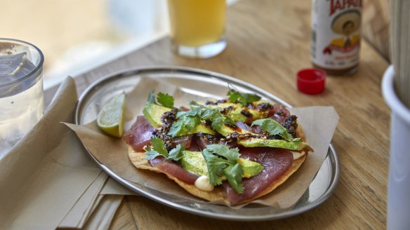 Yellowfin tuna tostada with avocado and salsa macha.