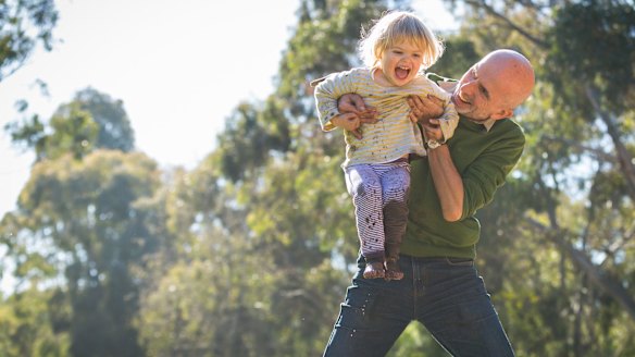 Jarek Luszpinski plays with his two year old daughter Pola.