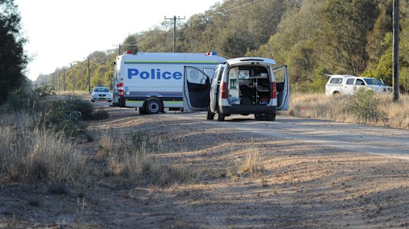 Police block off the road at Talga Lane on the Newell Highway at Croppa Creek, north of Moree, after Tuesday's fatal shooting. 