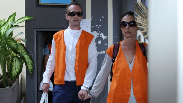 David Taylor, left, walks with Sara Connor prior to the start of their trial at Denpasar District Court in Bali on Wednesday.