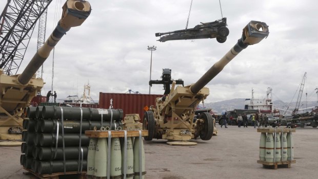 Workers unload artillery, part of a military donation from the US government to the Lebanese army, in Beirut on Sunday. 