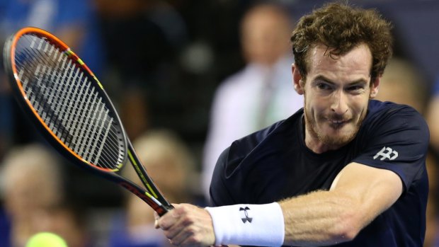 Forceful: Andy Murray during a 2015 Davis Cup singles match against Bernard Tomic.