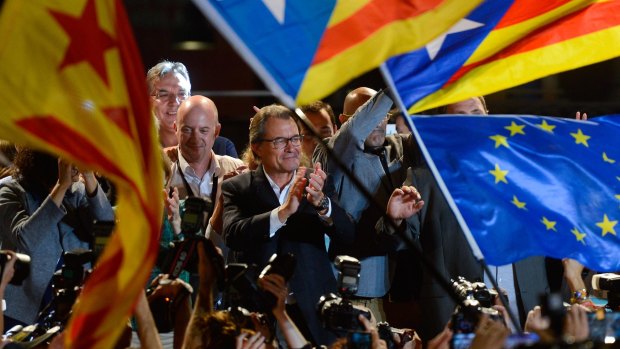 Catalan regional president Artur Mas (centre) celebrates as the Catalan coalition Junts pel Si (Together for the Yes) claims victory in the regional elections  in Catalonia.