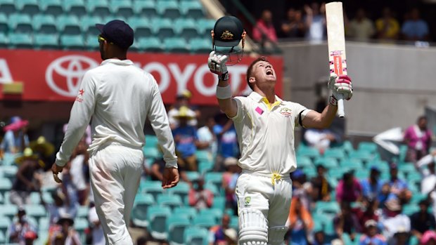 David Warner takes a moment to glance heavenwards after reaching his century on day one of the SCG Test.