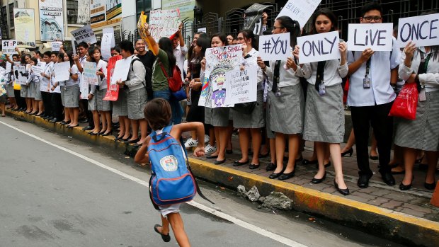 Filipino students protest the killings in President Duterte's  "war on drugs".