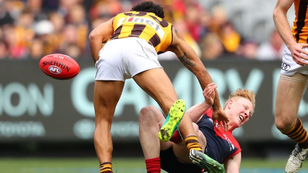The Hawks' Cyril Rioli tackles Demon Clayton Oliver in the round 20 clash at the MCG last Saturday.